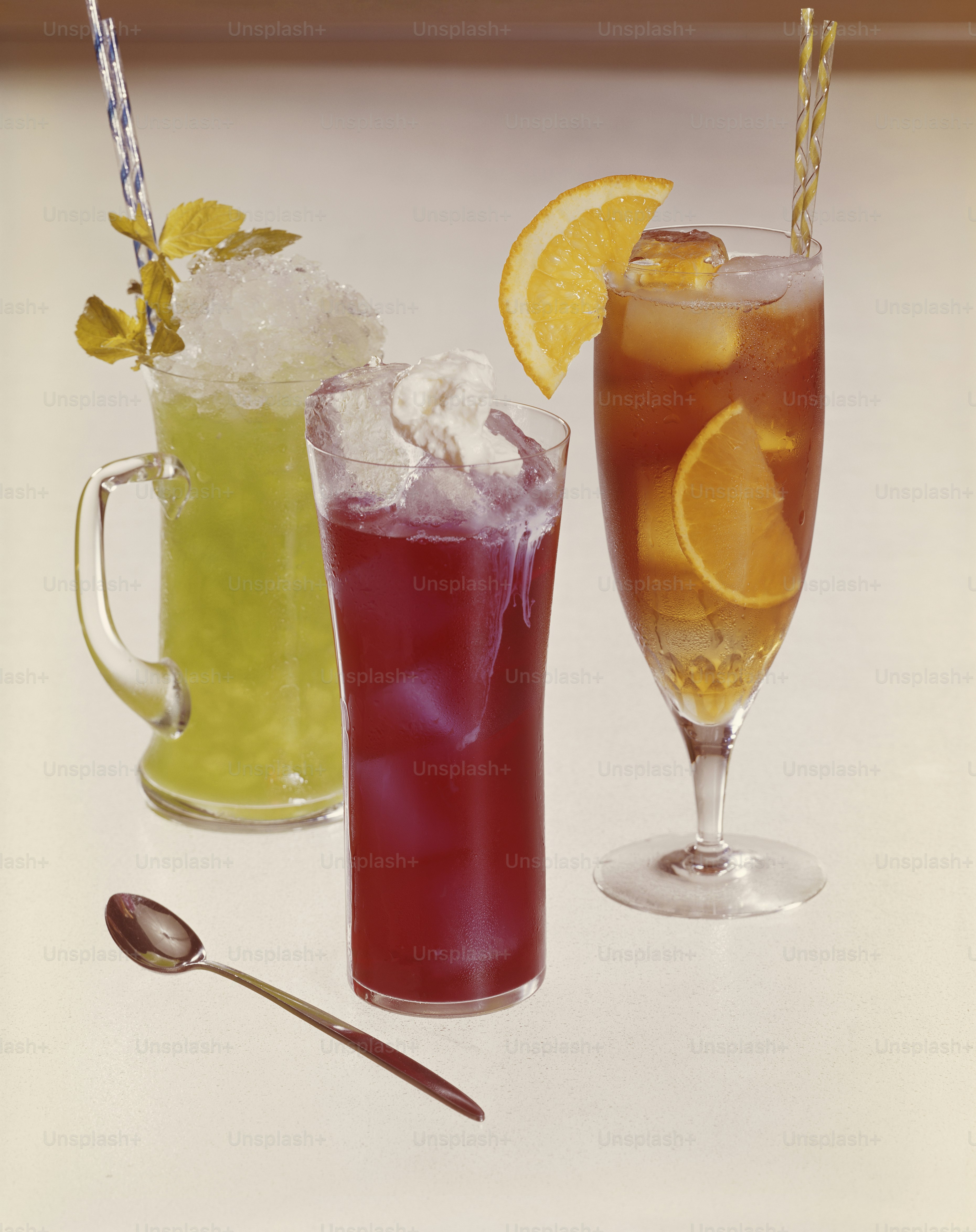 three different types of drinks on a table